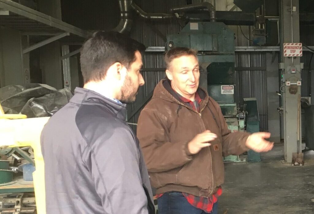 Gabriel Ribeiro and mentor Bryan Thiessen at Namaka Farms in Saskatchewan