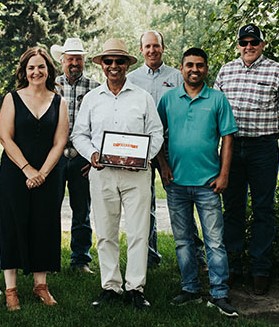 Dr. Surya Acharya after receiving the BCRC's 2021 Canadian Beef Industry Award for Outstanding Research and Innovation. Also pictured are Andrea Brocklebank, Doug Wray, Craig Lehr, Dr. Hari Prasad Poudel, and Graeme Finn