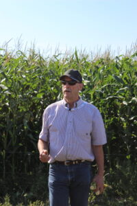 Dr. Bart Lardner in corn during research field day